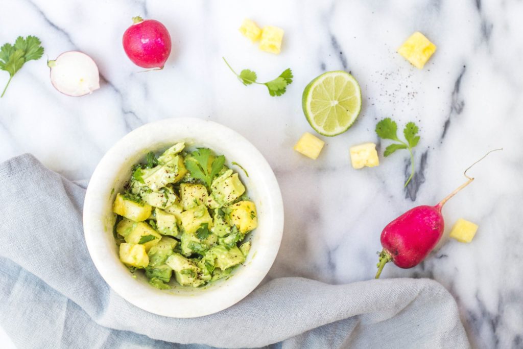 Salad with avocado in a bowl. Photo by Alison Marras on Unsplash