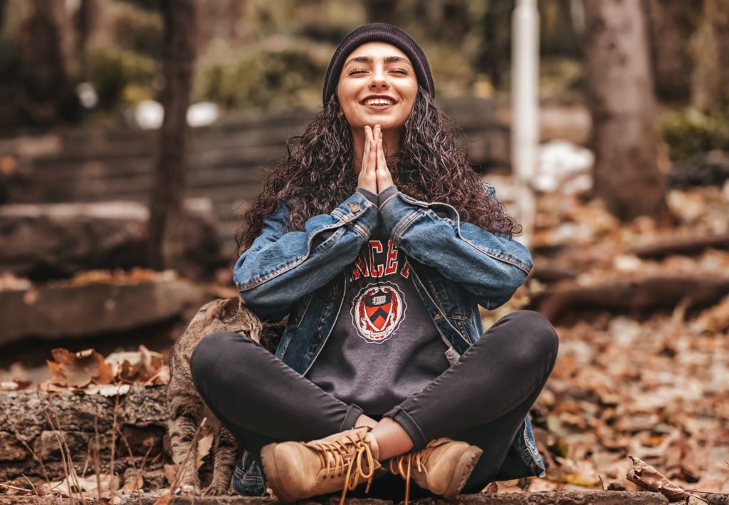 Person meditation, smiling in joy.