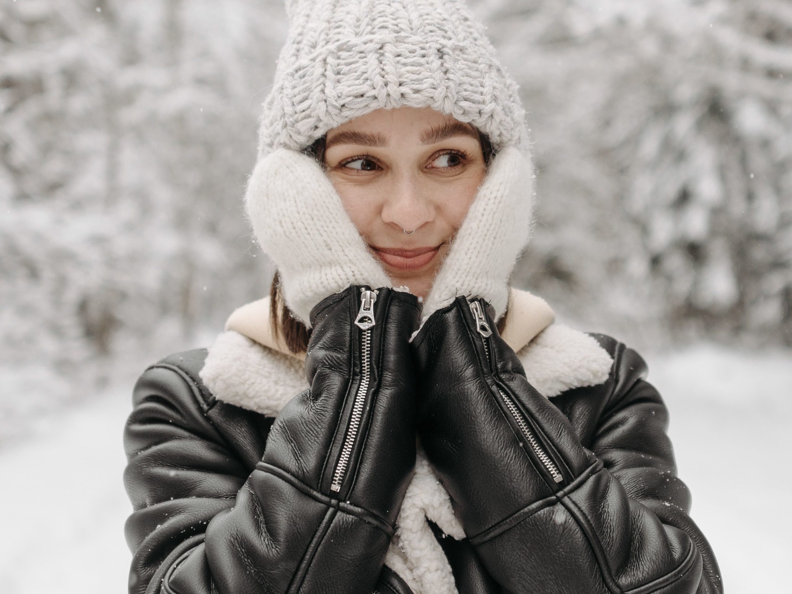 Person in the winter touching their skin