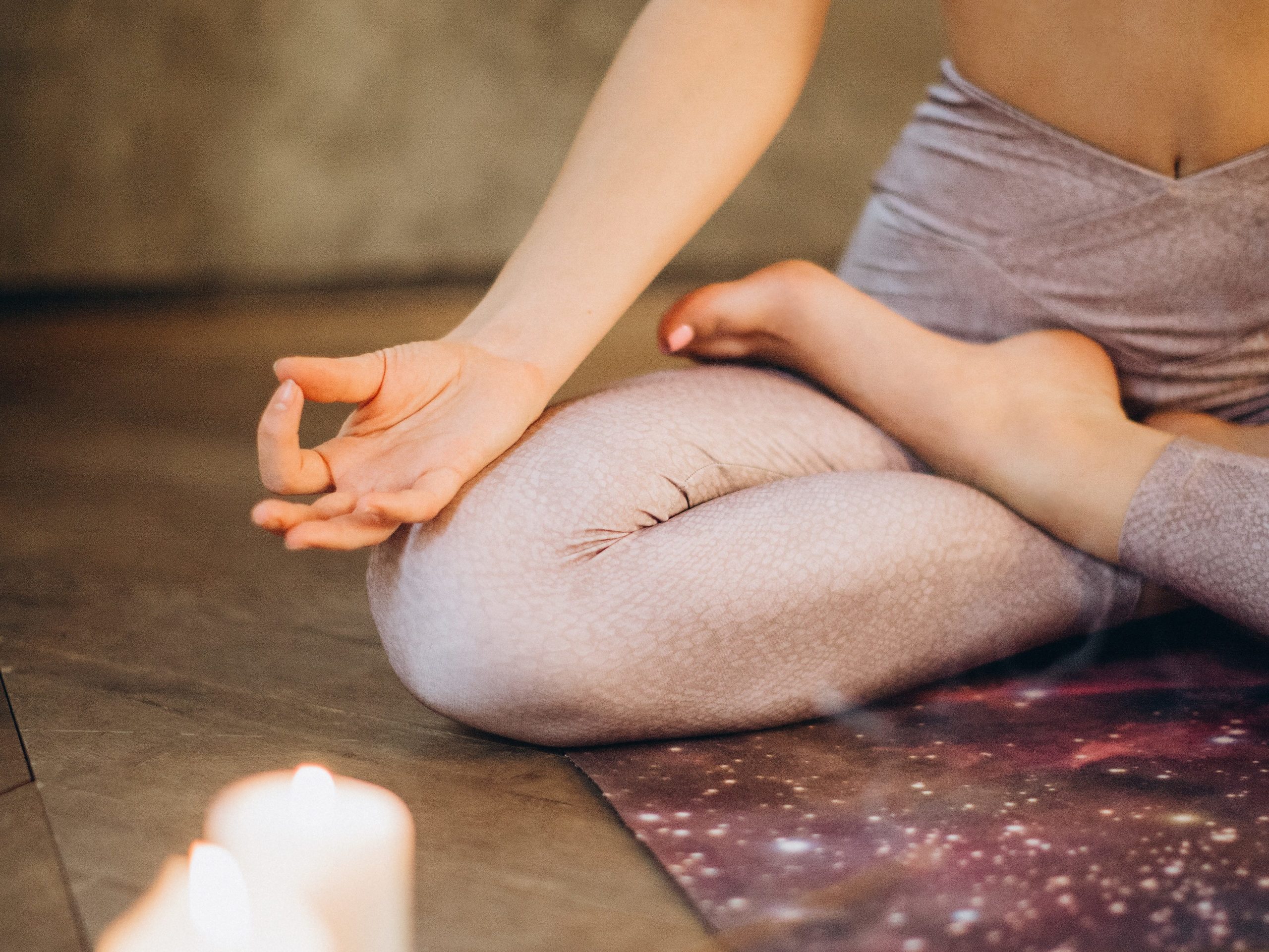 Person sitting cross legged, meditating