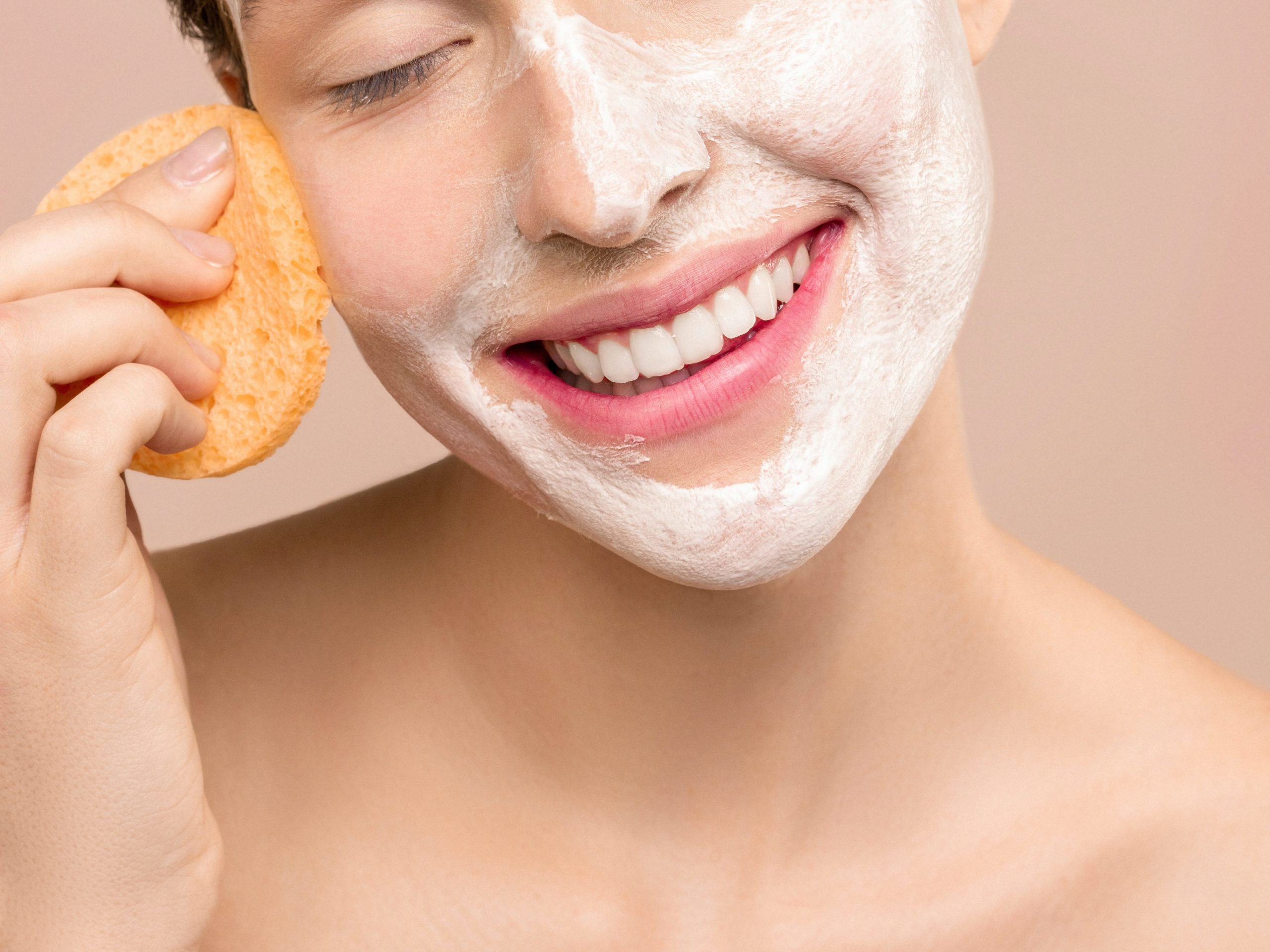 Person washing off a cleanser