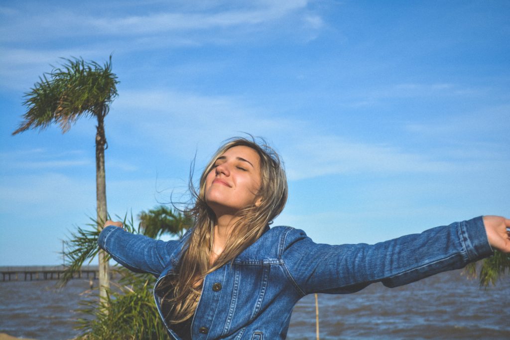 Person happy, practicing self-care