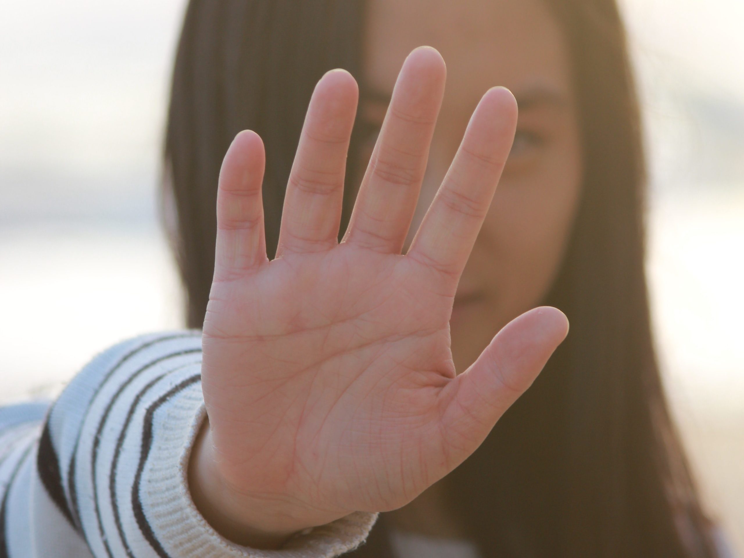 person doing five-finger breathing