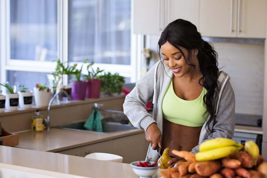 person chopping up fruit, total fitness