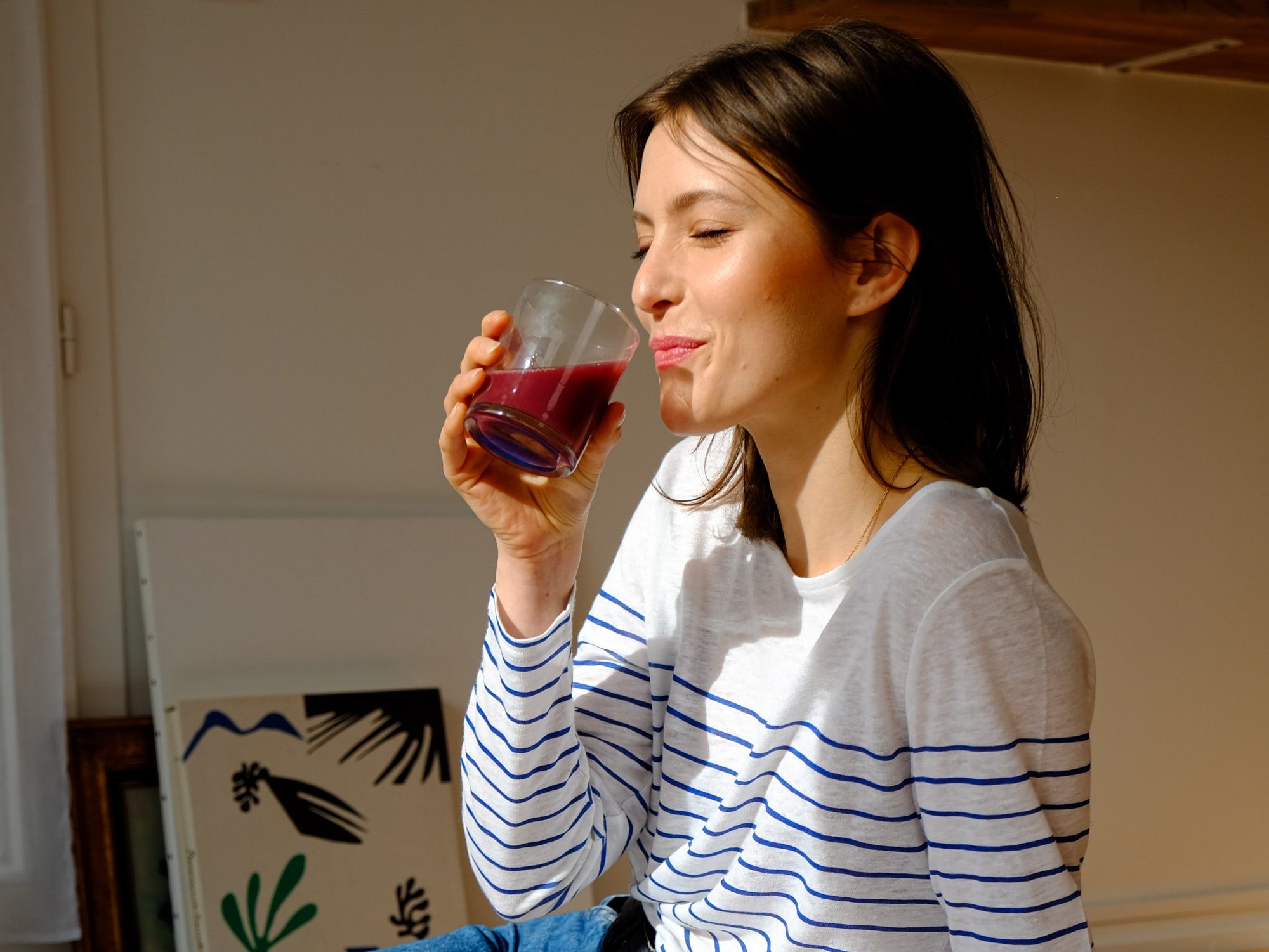 person drinking a healthy product tea