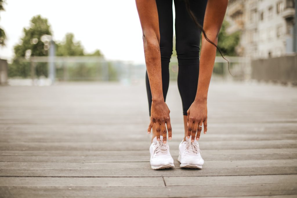 Photo by Andrea Piacquadio: https://www.pexels.com/photo/slim-woman-warming-up-while-training-alone-on-street-sports-ground-3769002/