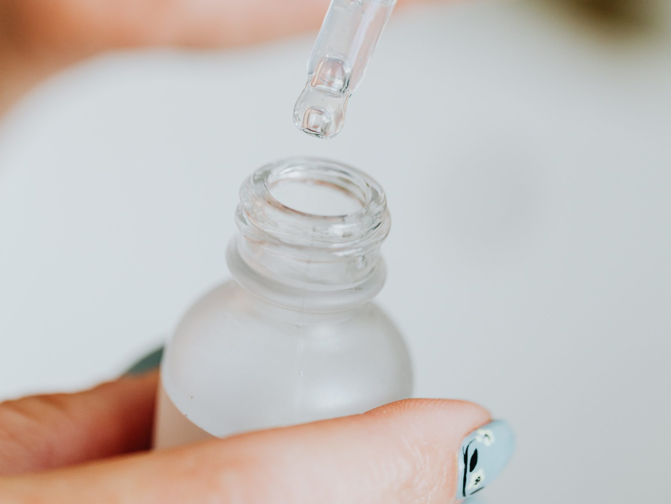 person using a copper peptides serum