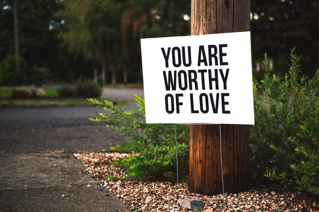 image of a sign with the affirmation you are worthy of love