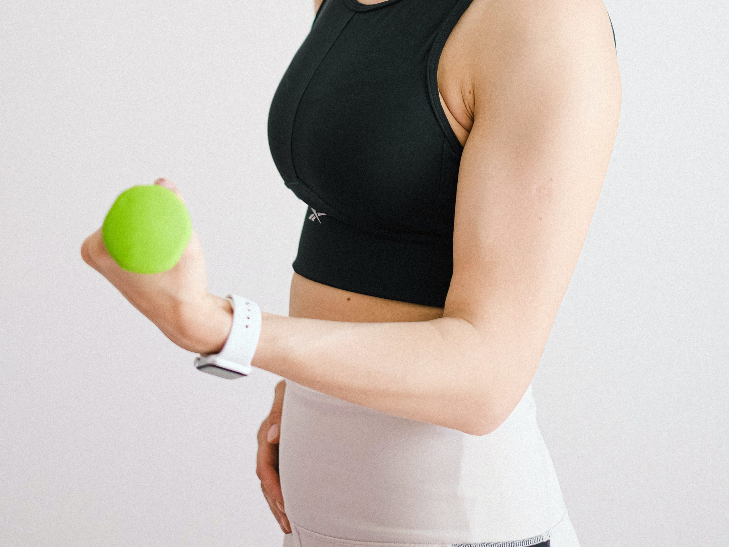 image of a person with weight in hand, exercising.