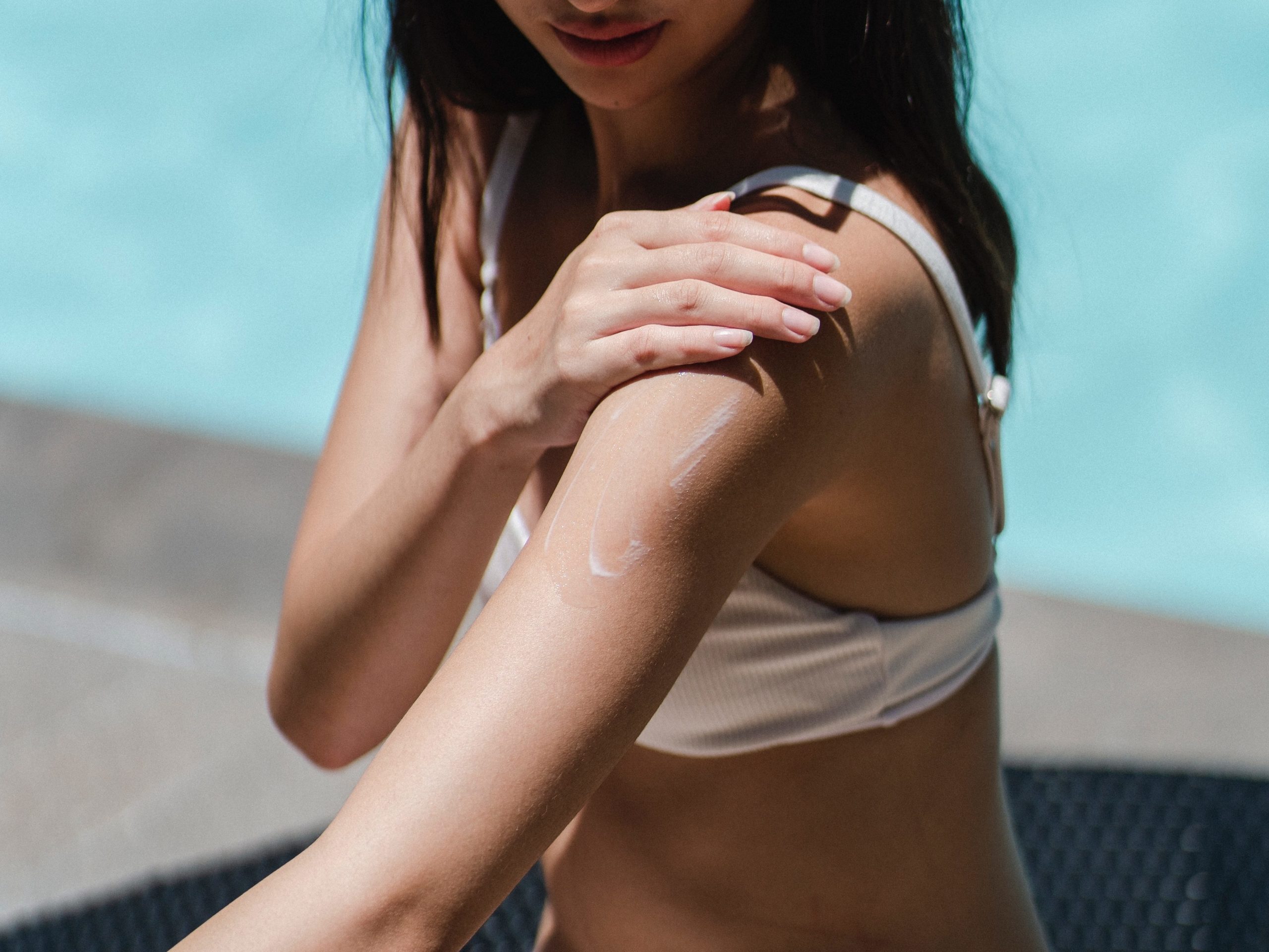 person applying sunscreen